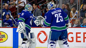 VANCOUVER, BC - MARCH 9: Thatcher Demko #35 of the Vancouver Canucks is switch out with teammate Jacob Markstrom #25 during their NHL game against the Vegas Golden Knights at Rogers Arena March 9, 2019 in Vancouver, British Columbia, Canada. (Photo by Jeff Vinnick/NHLI via Getty Images)