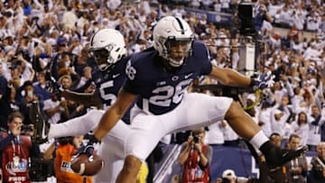 Dec 3, 2016; Indianapolis, IN, USA; Penn State Nittany Lions running back Saquon Barkley (26) celebrates with teammates after catching a touchdown pass against the Wisconsin Badgers in the second half during the Big Ten Championship college football game at Lucas Oil Stadium. Mandatory Credit: Brian Spurlock-USA TODAY Sports