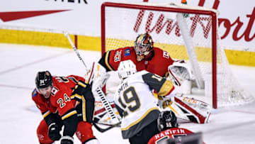 CALGARY, AB - MARCH 10: Vegas Golden Knights Right Wing Reilly Smith (19) takes a shot on Calgary Flames Goalie David Rittich (33) during the second period of an NHL game where the Calgary Flames hosted the Vegas Golden Knights on March 10, 2019, at the Scotiabank Saddledome in Calgary, AB. (Photo by Brett Holmes/Icon Sportswire via Getty Images)