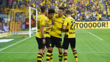 (L to R) Dortmund's German forward Maximilian Philipp, Dortmund's English midfielder Jadon Sancho, Dortmund's German midfielder Julian Weigl and Dortmund's US midfielder Christian Pulisic celebrate after scoring during the German first division Bundesliga football match Borussia Dortmund vs Bayer Leverkusen, in Dortmund, western Germany, on April 21, 2018. (Photo by Patrik STOLLARZ / AFP) /