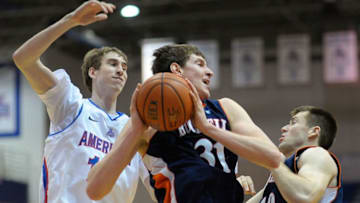 OKC Thunder: WASHINGTON DC , FEBRUARY 23: Bucknell's #31 Mike Muscala, center, grabs a rebound over American's Riley Grafft, (Photo by John McDonnell/The Washington Post via Getty Images)