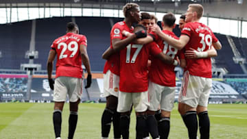 Manchester United's Brazilian midfielder Fred celebrates with teammates a goal during the English Premier League football match between Tottenham Hotspur and Manchester United at Tottenham Hotspur Stadium in London, on April 11, 2021. - - RESTRICTED TO EDITORIAL USE. No use with unauthorized audio, video, data, fixture lists, club/league logos or 'live' services. Online in-match use limited to 120 images. An additional 40 images may be used in extra time. No video emulation. Social media in-match use limited to 120 images. An additional 40 images may be used in extra time. No use in betting publications, games or single club/league/player publications. (Photo by Adrian DENNIS / POOL / AFP) / RESTRICTED TO EDITORIAL USE. No use with unauthorized audio, video, data, fixture lists, club/league logos or 'live' services. Online in-match use limited to 120 images. An additional 40 images may be used in extra time. No video emulation. Social media in-match use limited to 120 images. An additional 40 images may be used in extra time. No use in betting publications, games or single club/league/player publications. / RESTRICTED TO EDITORIAL USE. No use with unauthorized audio, video, data, fixture lists, club/league logos or 'live' services. Online in-match use limited to 120 images. An additional 40 images may be used in extra time. No video emulation. Social media in-match use limited to 120 images. An additional 40 images may be used in extra time. No use in betting publications, games or single club/league/player publications. (Photo by ADRIAN DENNIS/POOL/AFP via Getty Images)