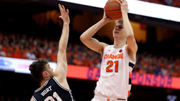 SYRACUSE, NEW YORK - FEBRUARY 01: Matthew Hurt #21 of the Duke Blue Devils guards Marek Dolezaj #21 of the Syracuse Orange as he shoots the ball during the second half of an NCAA basketball game at the Carrier Dome on February 01, 2020 in Syracuse, New York. (Photo by Bryan M. Bennett/Getty Images)