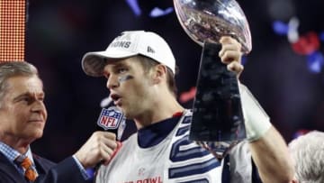 Feb 1, 2015; Glendale, AZ, USA; New England Patriots quarterback Tom Brady (12) celebrates with the Vince Lombardi Trophy after beating the Seattle Seahawks in Super Bowl XLIX at University of Phoenix Stadium. Mandatory Credit: Matthew Emmons-USA TODAY Sports