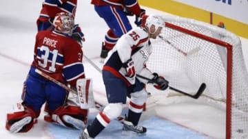 Sep 28, 2014; Montreal, Quebec, CAN; Washington Capitals forward Joel Ward (42) (not pictured) scores a goal against Montreal Canadiens goalie Carey Price (31) and teammate Washington Capitals forward Jason Chimera (25) looks on during the third period at the Bell Centre. Mandatory Credit: Eric Bolte-USA TODAY Sports