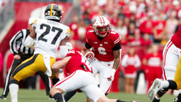 Oct 30, 2021; Madison, Wisconsin, USA; Wisconsin Badgers running back Chez Mellusi (6) carries the football during the first quarter against the Iowa Hawkeyes at Camp Randall Stadium. Mandatory Credit: Jeff Hanisch-USA TODAY Sports