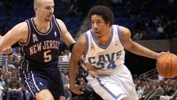 CLEVELAND, UNITED STATES: Cleveland Cavaliers' guard Andre Miller (R) drives against New Jersey Nets' guard Jason Kidd during the fourth quarter 19 March 2002 at Gund Arena in Cleveland, OH. Cleveland defeated New Jersey 100-97. AFP Photo/David Maxwell (Photo credit should read DAVID MAXWELL/AFP via Getty Images)