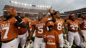 AUSTIN, TX - SEPTEMBER 22: Tre Watson #5 of the Texas Longhorns celebrates with teammates after the game against the TCU Horned Frogs at Darrell K Royal-Texas Memorial Stadium on September 22, 2018 in Austin, Texas. (Photo by Tim Warner/Getty Images)