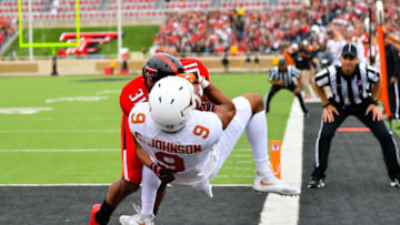 LUBBOCK, TX - NOVEMBER 05: Collin Johnson #9 of the Texas Longhorns catches a touchdown pass against the defense of Justis Nelson #31 of the Texas Tech Red Raiders during the first half of the game between the Texas Tech Red Raiders and the Texas Longhorns on November 5, 2016 at AT&T Jones Stadium in Lubbock, Texas. (Photo by John Weast/Getty Images)