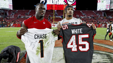 TAMPA, FLORIDA - DECEMBER 18: Ja'Marr Chase #1 of the Cincinnati Bengals and Devin White #45 of the Tampa Bay Buccaneers exchange jerseys after the game at Raymond James Stadium on December 18, 2022 in Tampa, Florida. (Photo by Douglas P. DeFelice/Getty Images)