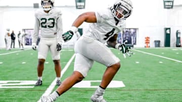 Michigan State linebacker Jacoby Windmon runs a drill during practice on Tuesday, March 29, 2022, at the indoor football facility in East Lansing.220329 Msu Fb Practice 099a