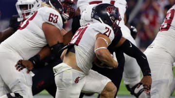 HOUSTON, TEXAS - SEPTEMBER 13: Max Borghi #21 of the Washington State Cougars rushes with the ball during the first quarter against the Houston Cougars during the Texas Kickoff at NRG Stadium on September 13, 2019 in Houston, Texas. (Photo by Bob Levey/Getty Images)