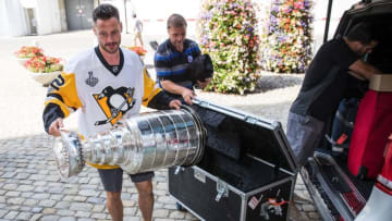 Swiss professional ice hockey player Mark Streit arrives with the Stanley Cup trophy at the parliament building in Bern, Switzerland, August 2, 2017.Streit won the trophy with the Pittsburgh Penguins in 2017. / AFP PHOTO / POOL / PETER KLAUNZER (Photo credit should read PETER KLAUNZER/AFP/Getty Images)