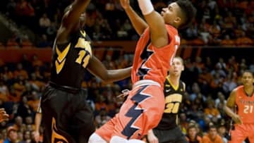 Feb 7, 2016; Champaign, IL, USA; Illinois Fighting Illini guard D.J. Williams (0) drives to the basket against Iowa Hawkeyes guard Peter Jok (14) during the first half at State Farm Center. Mandatory Credit: Mike Granse-USA TODAY Sports