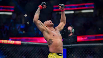 Jan 22, 2022; Anaheim, California, USA; Michael Morales (red gloves) celebrates defeating Trevin Giles (blue gloves) during UFC 270 at Honda Center. Mandatory Credit: Gary A. Vasquez-USA TODAY Sports