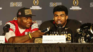Jan 12, 2015; Arlington, TX, USA; Ohio State Buckeyes quarterback Cardale Jones (12) talks with running back Ezekiel Elliott (15) during a press conference after beating the Oregon Ducks in the 2015 CFP National Championship Game at AT&T Stadium. Mandatory Credit: Tim Heitman-USA TODAY Sports