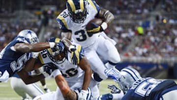 Sep 21, 2014; St. Louis, MO, USA; St. Louis Rams running back Zac Stacy (30) attempts to leap over the line against the Dallas Cowboys during the first half at the Edward Jones Dome. Mandatory Credit: Jasen Vinlove-USA TODAY Sports