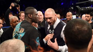 Tyson Fury of Britain (R) challeges Deontay Wilder of the US (L) after Wilder defeated Artur Szpilka of Poland in their WBC Heavyweight Championship bout at Barclay's Center in Brooklyn, New York, on January 16, 2016.Wilder knocked out Szpilka in the ninth round. / AFP / AFP PHOTO / DON EMMERT (Photo credit should read DON EMMERT/AFP/Getty Images)