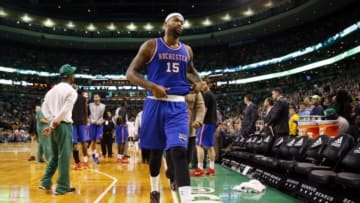 Dec 31, 2014; Boston, MA, USA; Sacramento Kings center DeMarcus Cousins (15) untucks his shirt as he heads to the locker room after being ejected from the game after receiving his second technical foul during the second half of the Boston Celtics 106-84 win over the Sacramento Kings at TD Garden. Mandatory Credit: Winslow Townson-USA TODAY Sports