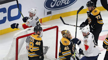 BOSTON - NOVEMBER 12: Boston Bruins goalie Tuukka Rask looks skyward after the Panthers scored to tie the game at 4-4. Florida's Aleksander Barkov (16, right) and Evgenii Dadonov (63, top) celebrate as the Bruins' Matt Grzelcyk (48) and Charlie McAvoy (73) do not. The Boston Bruins host the Florida Panthers in a regular season NHL hockey game at TD Garden in Boston on Nov. 12, 2019. (Photo by Jim Davis/The Boston Globe via Getty Images)