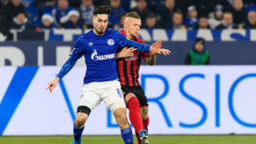 GELSENKIRCHEN, GERMANY - DECEMBER 21: (BILD ZEITUNG OUT) Suat Serdar of FC Schalke 04 and Jonathan Schmid of SC Freiburg battle for the ball during the Bundesliga match between FC Schalke 04 and Sport-Club Freiburg at Veltins-Arena on December 21, 2019 in Gelsenkirchen, Germany. (Photo by TF-Images/Getty Images)