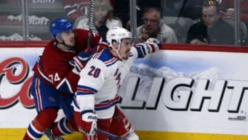 May 19, 2014; Montreal, Quebec, CAN; Montreal Canadiens defenseman Alexei Emelin (74) collides with New York Rangers forward Chris Kreider (20) during the third period in game two of the Eastern Conference Final of the 2014 Stanley Cup Playoffs at the Bell Centre. Mandatory Credit: Eric Bolte-USA TODAY Sports