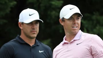 ATLANTA, GEORGIA - AUGUST 25: Brooks Koepka of the United States and Rory McIlroy of Northern Ireland look on from the eighth tee during the final round of the TOUR Championship at East Lake Golf Club on August 25, 2019 in Atlanta, Georgia. (Photo by Streeter Lecka/Getty Images)