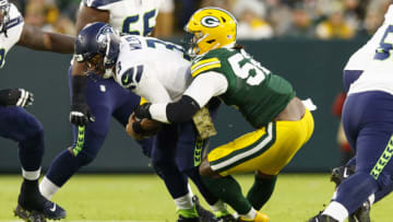 Nov 14, 2021; Green Bay, Wisconsin, USA; Green Bay Packers outside linebacker Rashan Gary (52) sacks Seattle Seahawks quarterback Russell Wilson (3) during the second quarter at Lambeau Field. Mandatory Credit: Jeff Hanisch-USA TODAY Sports