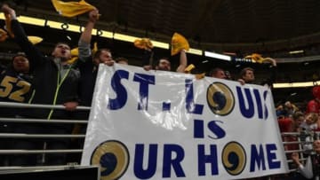 Dec 17, 2015; St. Louis, MO, USA; St. Louis Rams fans hold banner that reads "St. Louis is our home" in reference to the team
