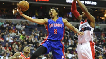 Feb 28, 2015; Washington, DC, USA; Detroit Pistons guard Spencer Dinwiddie (8) shoots as Washington Wizards guard John Wall (2) looks on during the second half at Verizon Center. The Wizards won 99 - 95. Mandatory Credit: Brad Mills-USA TODAY Sports