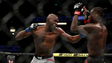 ANAHEIM, CALIFORNIA - AUGUST 17: Khama Worthy throws a punch at Devonte Smith in the first round during their Lightweight Bout at UFC 241 at Honda Center on August 17, 2019 in Anaheim, California. (Photo by Joe Scarnici/Getty Images)