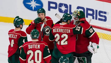 Nov 17, 2016; Saint Paul, MN, USA; Minnesota Wild goalie Devan Dubnyk (40) celebrates the win after the game against the Boston Bruins at Xcel Energy Center. The Minnesota Wild beat the Boston Bruins 1-0. Mandatory Credit: Brad Rempel-USA TODAY Sports