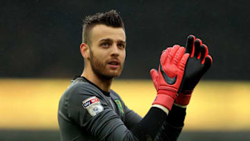 NORWICH, ENGLAND - APRIL 28: Angus Gunn of Norwich City leaves the field following victory during the Sky Bet Championship match between Norwich City and Leeds United at Carrow Road on April 28, 2018 in Norwich, England. (Photo by Stephen Pond/Getty Images)