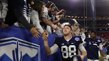 GLENDALE, AZ - DECEMBER 30: Tight end Mike Gesicki #88 of the Penn State Nittany Lions celebrates with fans after defeating the Washington Huskies in the Playstation Fiesta Bowl at University of Phoenix Stadium on December 30, 2017 in Glendale, Arizona. The Nittany Lions defeated the Huskies 35-28. (Photo by Christian Petersen/Getty Images)