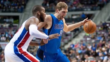 Feb 22, 2014; Auburn Hills, MI, USA; Detroit Pistons power forward Greg Monroe (10) guards Dallas Mavericks power forward Dirk Nowitzki (41) during the third quarter at The Palace of Auburn Hills. Dallas won 113-102. Mandatory Credit: Tim Fuller-USA TODAY Sports