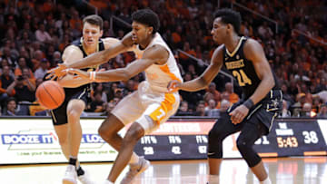 KNOXVILLE, TN - FEBRUARY 19: Yanni Wetzell #1 of the Vanderbilt Commodores, Kyle Alexander #11 of the Tennessee Volunteers, and Aaron Nesmith #24 of the Vanderbilt Commodores go after a loose ball during their game at Thompson-Boling Arena on February 19, 2019 in Knoxville, Tennessee. Tennessee won the game 58-46. (Photo by Donald Page/Getty Images)