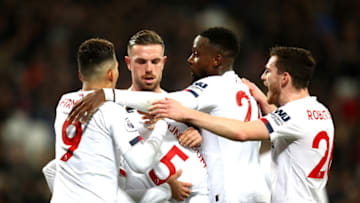 LONDON, ENGLAND - JANUARY 29: Mohamed Salah of Liverpool (hidden) celebrates with teammates after scoring his team's first goal during the Premier League match between West Ham United and Liverpool FC at London Stadium on January 29, 2020 in London, United Kingdom. (Photo by Julian Finney/Getty Images)