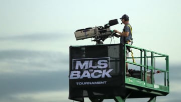 REUNION, FLORIDA - AUGUST 01: A cameraman works during a quarter final match of MLS Is Back Tournament between San Jose Earthquakes and Minnesota United at ESPN Wide World of Sports Complex on August 01, 2020 in Reunion, Florida. (Photo by Sam Greenwood/Getty Images)
