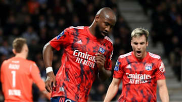 Lyon's French forward Moussa Dembele (C) celebrates scoring his team's first goal during the French L1 football match between AJ Auxerre and Olympique Lyonnais (OL) at Stade de l'Abbe-Deschamps in Auxerre, central France on February 17, 2023. (Photo by FRANCK FIFE / AFP) (Photo by FRANCK FIFE/AFP via Getty Images)