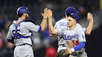 SAN DIEGO, CALIFORNIA - AUGUST 28: Russell Martin #55 and Enrique Hernandez #14 of the Los Angeles Dodgers react after defeating the San Diego Padres 6-4 in an extra inning game at PETCO Park on August 28, 2019 in San Diego, California. (Photo by Sean M. Haffey/Getty Images)