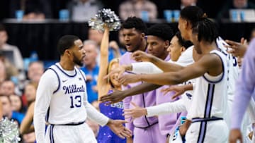 GREENSBORO, NORTH CAROLINA - MARCH 19: Desi Sills #13 of the Kansas State Wildcats celebrates with teammates during the second half against the Kentucky Wildcats in the second round of the NCAA Men's Basketball Tournament at The Fieldhouse at Greensboro Coliseum on March 19, 2023 in Greensboro, North Carolina. (Photo by Jacob Kupferman/Getty Images)