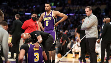 LOS ANGELES, CALIFORNIA - FEBRUARY 16: Talen Horton-Tucker #5 and head coach Frank Vogel of the Los Angeles Lakers check up on Anthony Davis #3 after an injury during the second quarter against the Utah Jazz at Crypto.com Arena on February 16, 2022 in Los Angeles, California. NOTE TO USER: User expressly acknowledges and agrees that, by downloading and or using this Photograph, user is consenting to the terms and conditions of the Getty Images License Agreement. (Photo by Katelyn Mulcahy/Getty Images)