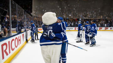 TORONTO, ON - NOVEMBER 26: Mitchell Marner #16 of the Toronto Maple Leafs hugs Carlton the Bear after defeating the Boston Bruins at the Scotiabank Arena on November 26, 2018 in Toronto, Ontario, Canada. (Photo by Mark Blinch/NHLI via Getty Images)