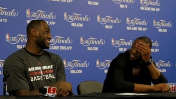 Jun 10, 2014; Miami, FL, USA; Miami Heat forward LeBron James and guard Dwyane Wade answer questions at a post-game press conference after game three against the San Antonio Spurs of the 2014 NBA Finals at American Airlines Arena. San Antonio defeated Miami 111-92. Mandatory Credit: Robert Mayer-USA TODAY Sports