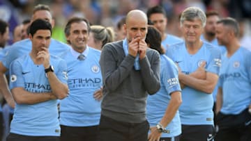 BRIGHTON, ENGLAND - MAY 12: Manchester City manager Pep Guardiola kisses his winner's medal after the Premier League match between Brighton & Hove Albion and Manchester City at American Express Community Stadium on May 12, 2019 in Brighton, United Kingdom. (Photo by Mike Hewitt/Getty Images)