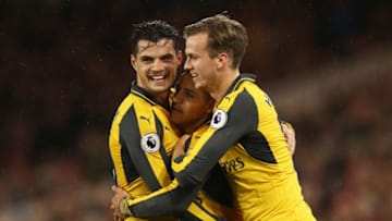 MIDDLESBROUGH, ENGLAND - APRIL 17: Alexis Sanchez of Arsenal (7) celebrates as he scores their first goal with Granit Xhaka (L) and Rob Holding (R) during the Premier League match between Middlesbrough and Arsenal at Riverside Stadium on April 17, 2017 in Middlesbrough, England. (Photo by Jan Kruger/Getty Images)