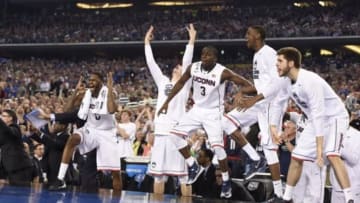 Apr 7, 2014; Arlington, TX, USA; Connecticut Huskies guard Terrence Samuel (3) and Phillip Nolan (0) reacts on the bench against the Kentucky Wildcats in the second half during the championship game of the Final Four in the 2014 NCAA Mens Division I Championship tournament at AT&T Stadium. Mandatory Credit: Bob Donnan-USA TODAY Sports