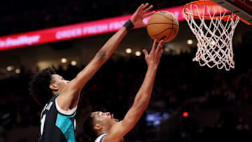PORTLAND, OREGON - APRIL 09: John Butler Jr. #21 of the Portland Trail Blazers blocks the shot of Jordan Poole #3 of the Golden State Warriors during the second quarter at Moda Center on April 09, 2023 in Portland, Oregon. NOTE TO USER: User expressly acknowledges and agrees that, by downloading and/or using this Photograph, user is consenting to the terms and conditions of the Getty Images License Agreement. (Photo by Steph Chambers/Getty Images)