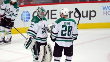 Mar 22, 2016; Chicago, IL, USA; Dallas Stars goalie Kari Lehtonen (32) and defenseman Stephen Johns (28) celebrate a victory following the third period against the Chicago Blackhawks at the United Center. Dallas won 6-2. Mandatory Credit: Dennis Wierzbicki-USA TODAY Sports