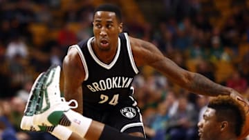 Oct 19, 2015; Boston, MA, USA; Brooklyn Nets forward Rondae Hollis-Jefferson (24) dribbles the ball as Boston Celtics guard Marcus Smart (R) falls during the first half at TD Garden. Mandatory Credit: Mark L. Baer-USA TODAY Sports